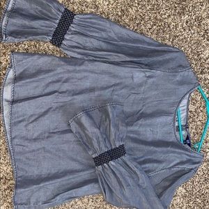 Super cute top with bell bottomed arms!